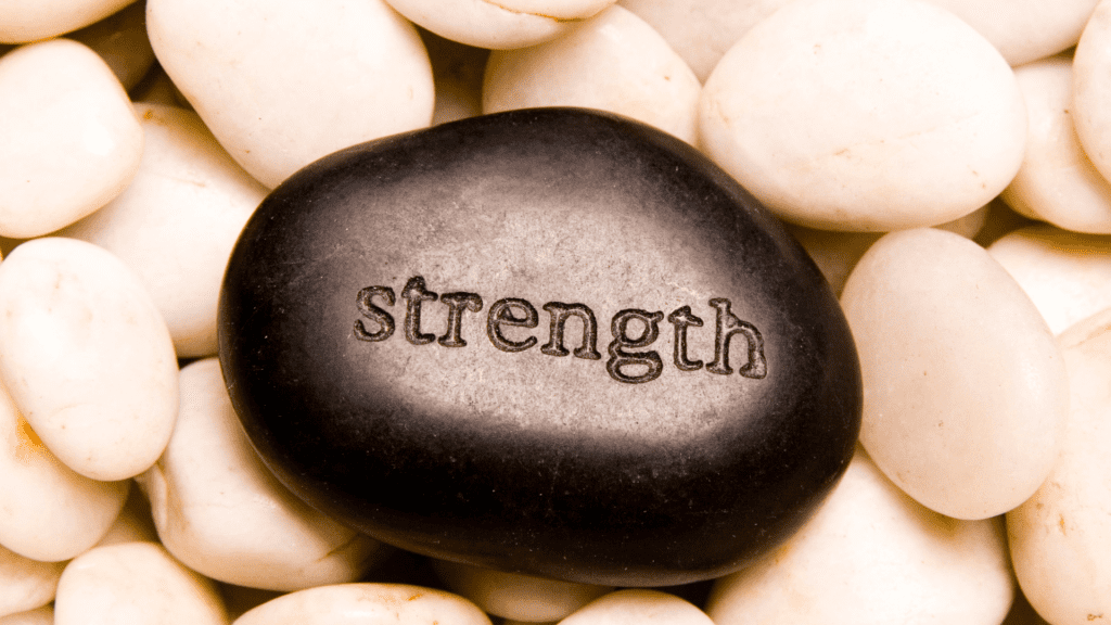 an image with a stone with the words strength in it 